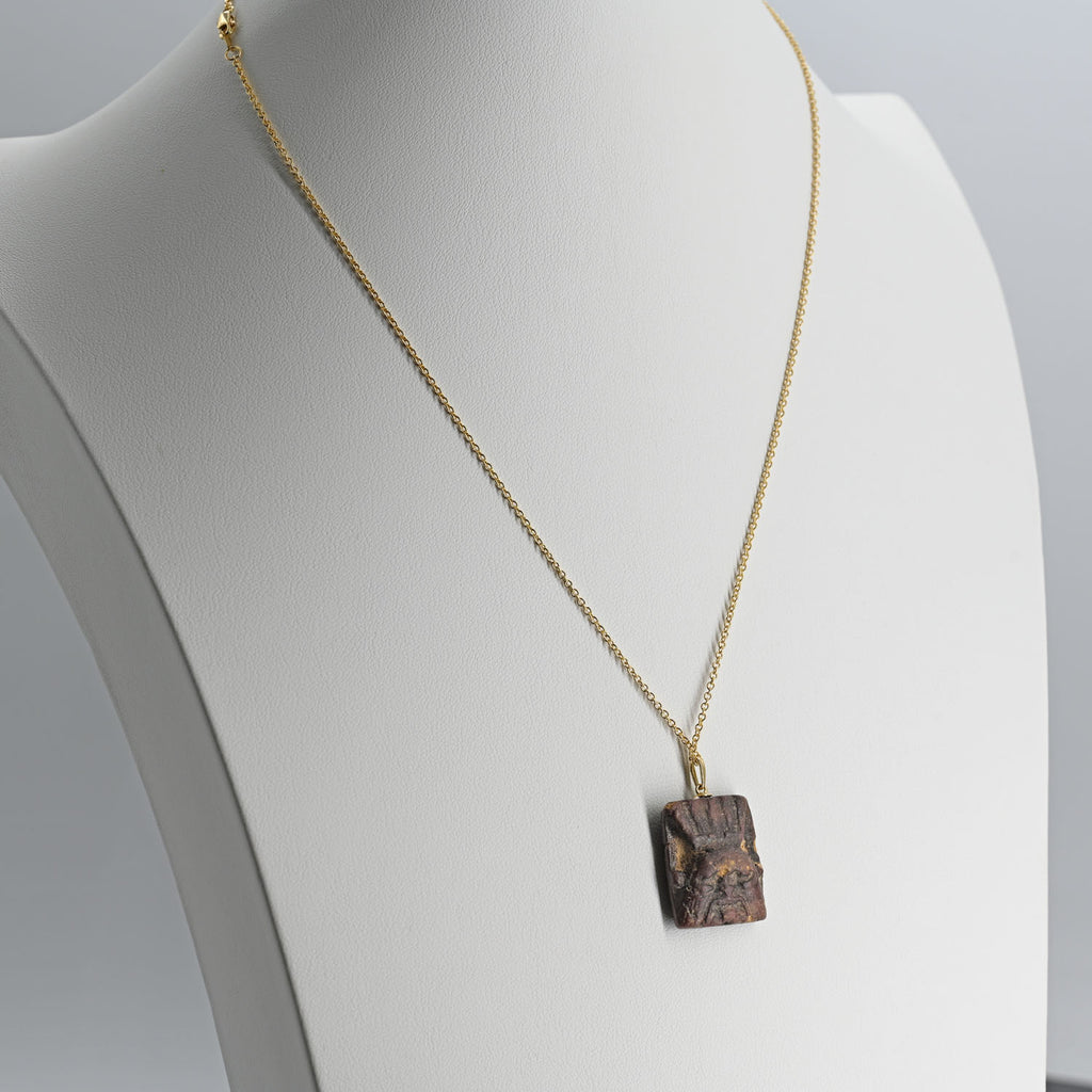 An Egyptian Faience Bes Plaque, Late Period, ca.  664 - 332 BCE