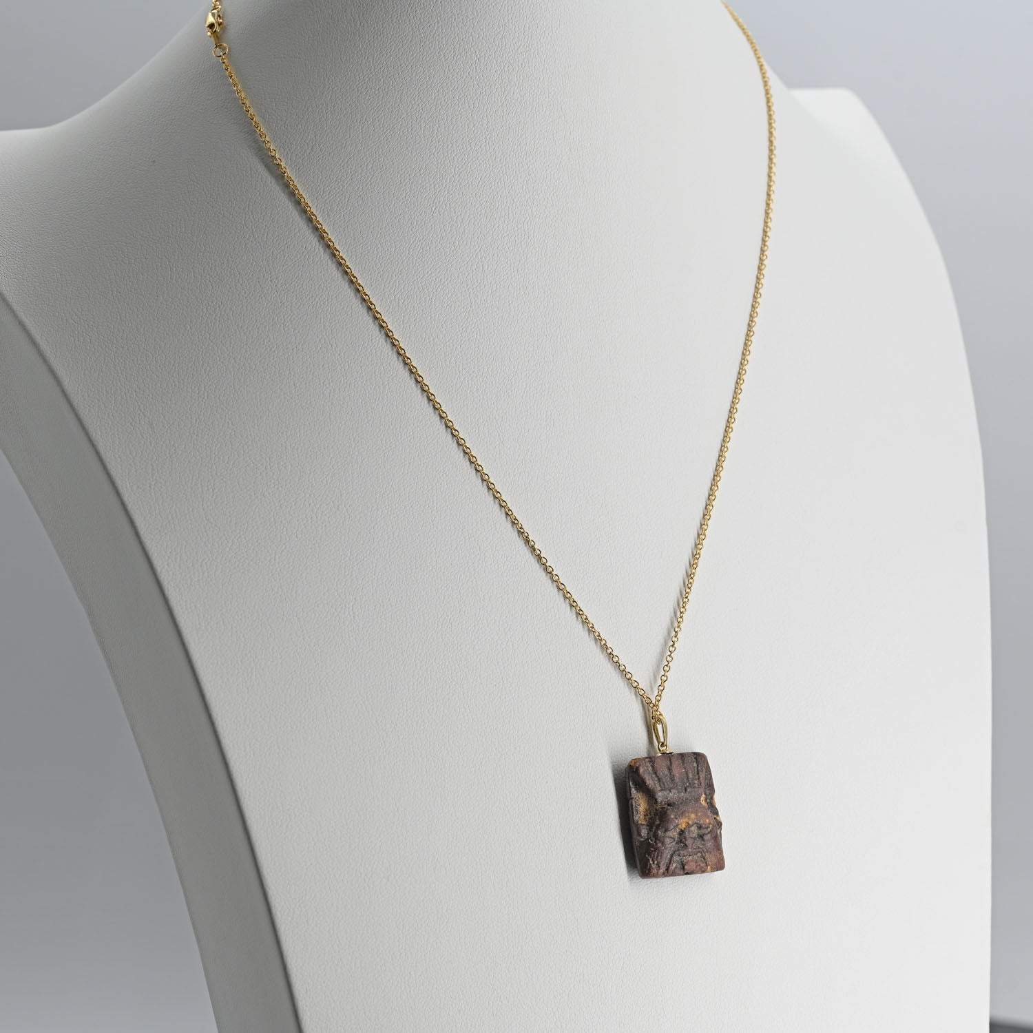 An Egyptian Faience Bes Plaque, Late Period, ca.  664 - 332 BCE