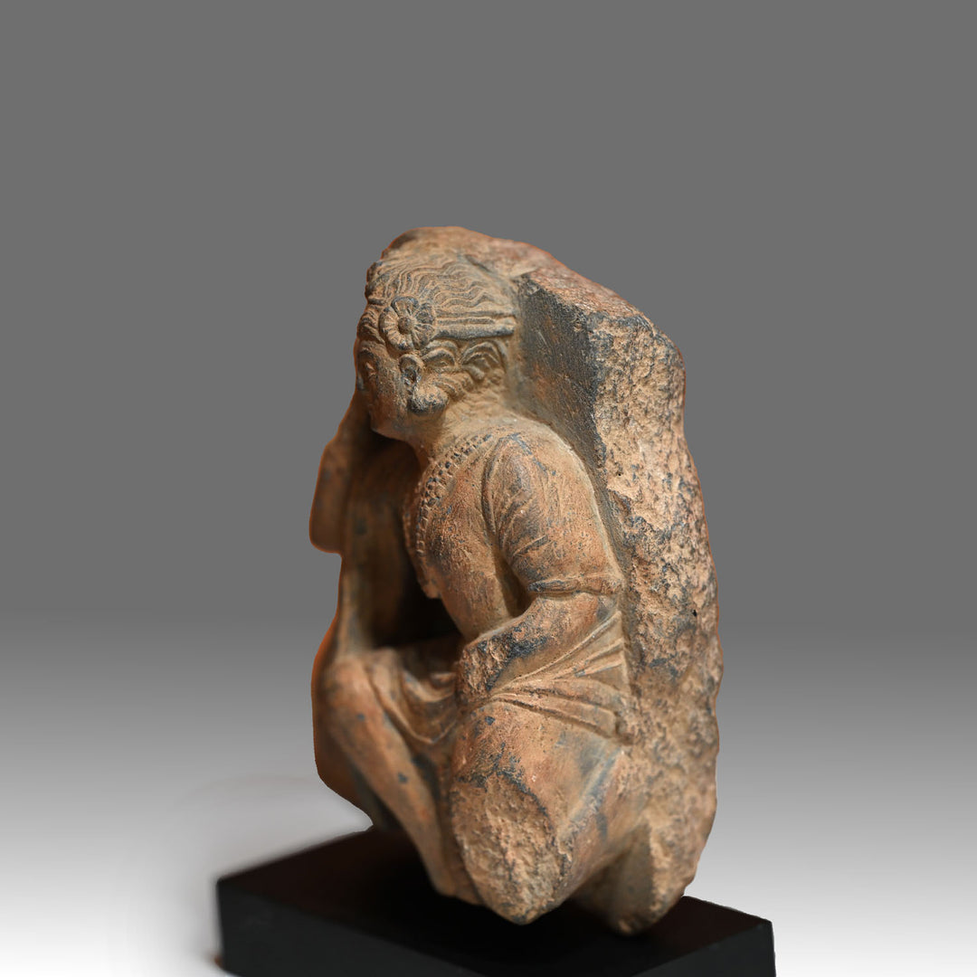 A Gandhara Relief Fragment of a Priestly Attendant, ca. 4th century CE