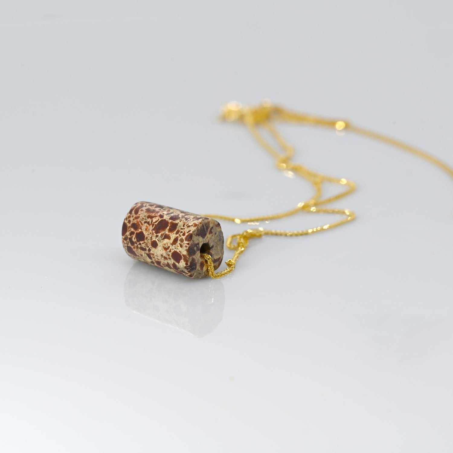 A Neo-Assyrian Brecciated Jasper Bead Pendant, 1st millennium BCE