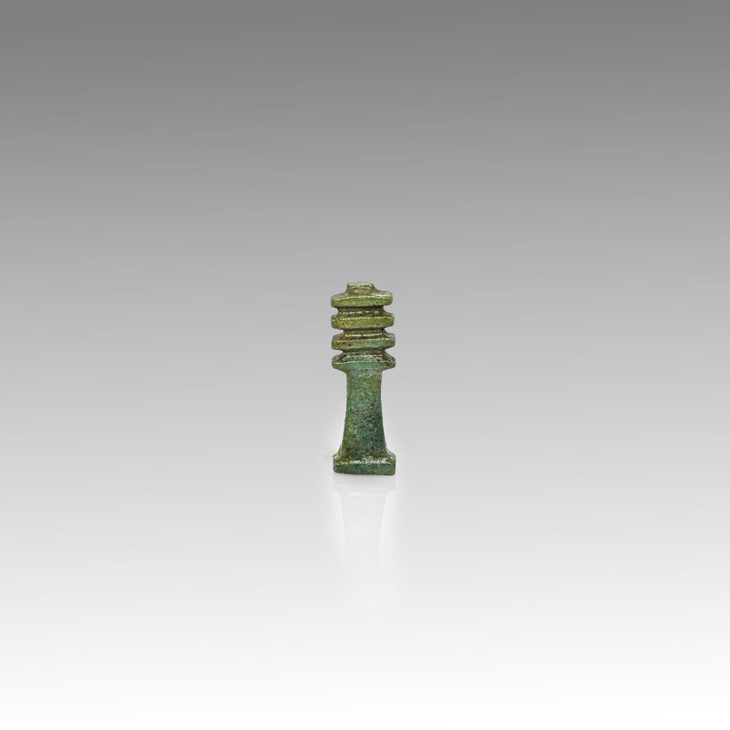 An Egyptian Green Faience Djed Pillar Amulet, Late Period, ca. 664 - 332 BCE