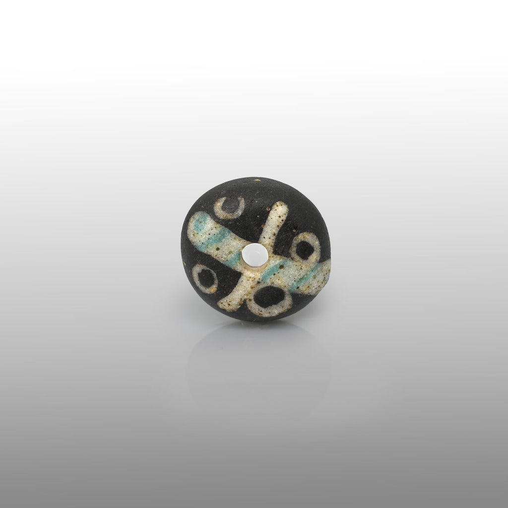 A Roman Decorated Glass Spindle Whorl,  Roman Imperial Period, ca. 2nd - 3rd century CE