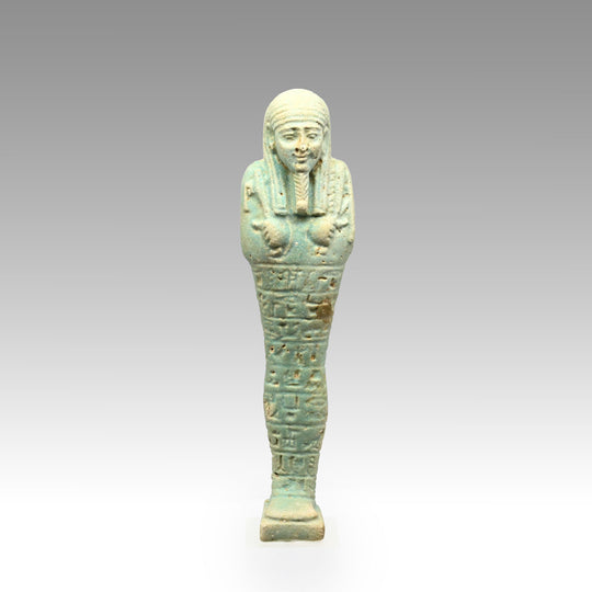 An Egyptian Green Glazed Shabti for the scribe Hapmen, 26th Dynasty, ca. 664 - 525 BCE