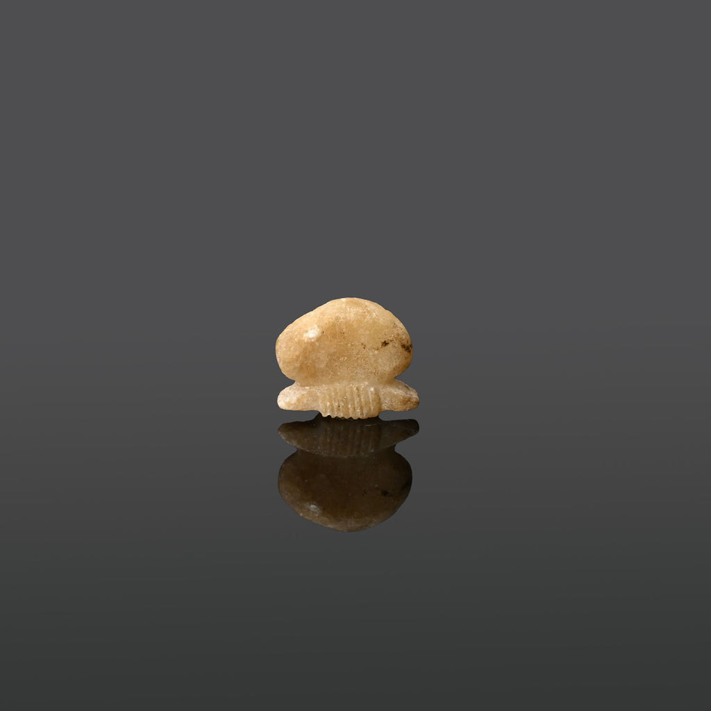 An Egyptian Alabaster Sun Disc Amulet, Late Period, ca. 664 - 332 BCE