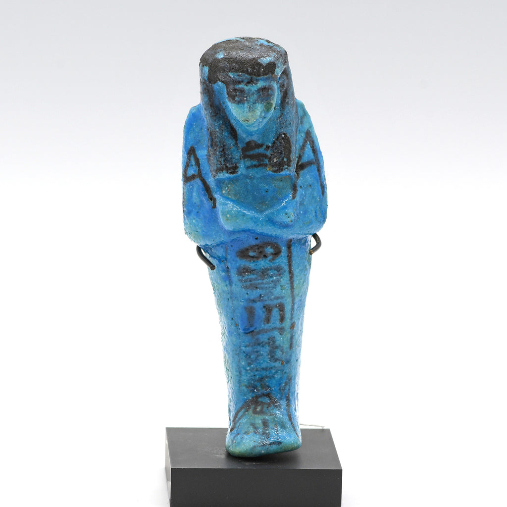 A Royal Egyptian bright blue glazed composition shabti for Princess AstEmKhebit, 21st Dynasty, Cache II, ca. 1069 - 945 BCE