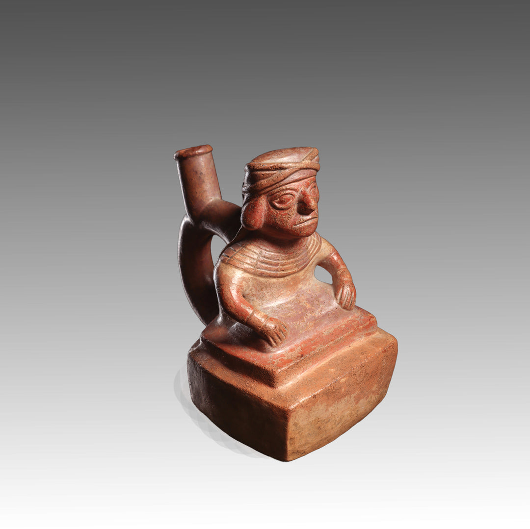 A Moche Terracotta Stirrup-Spout Vessel Depicting a Seated Dignitary, Moche II, ca. 300 - 500 CE