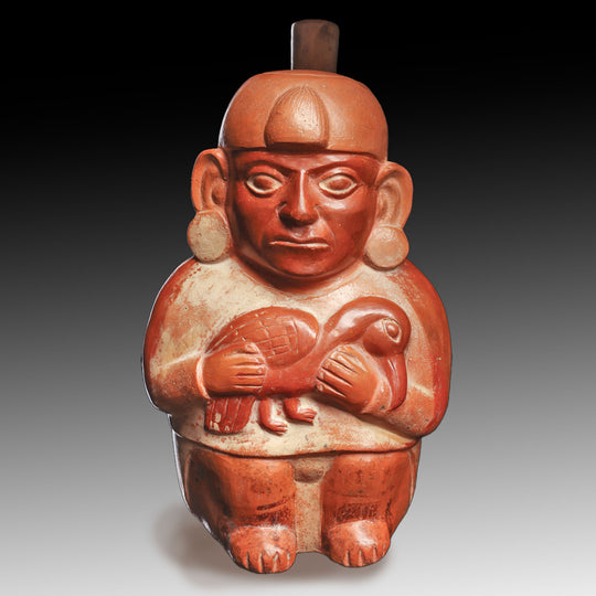 A Moche Effigy Vessel of a Figure Holding a Bird, Early Intermediate Period - Middle Horizon, ca. 200 - 900 CE
