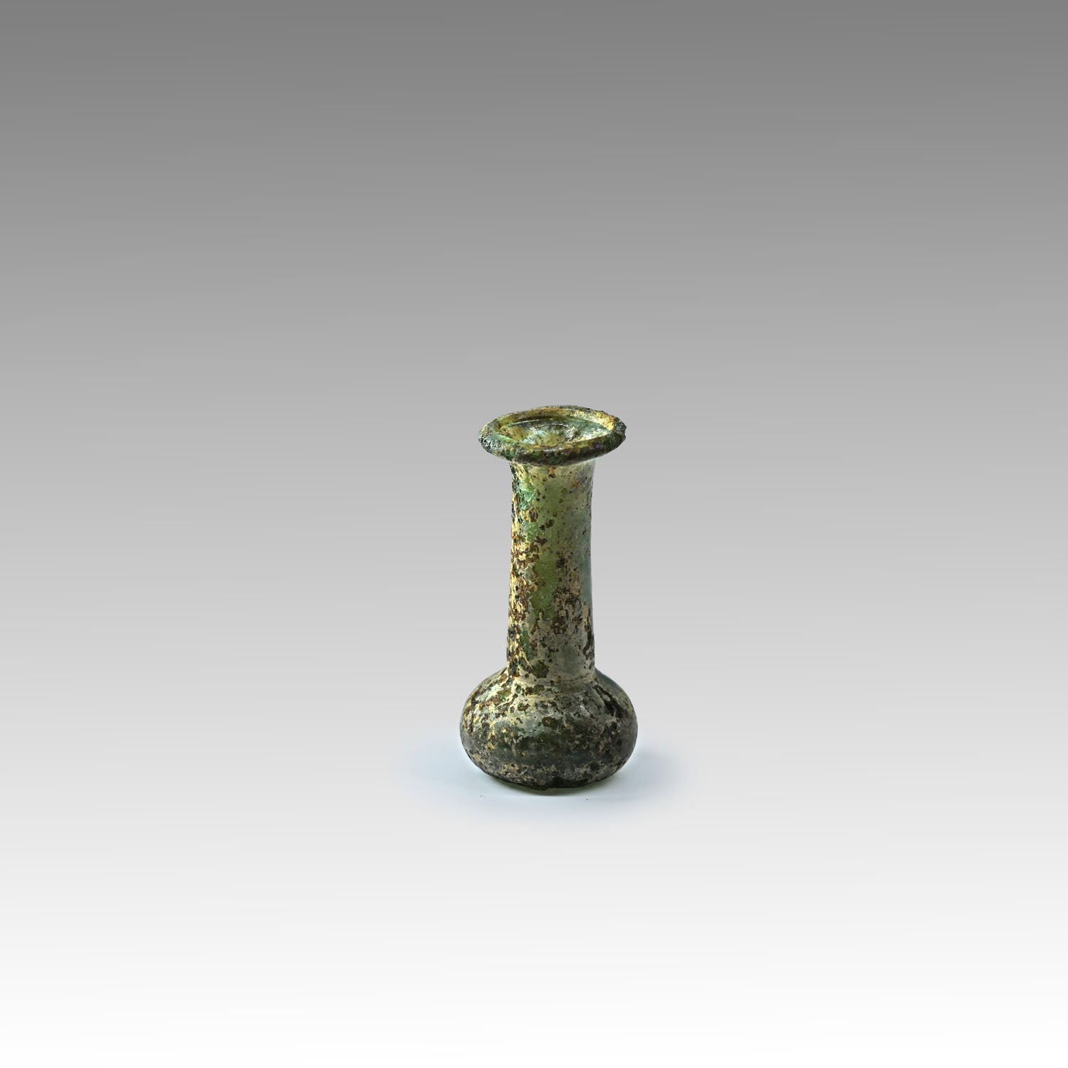 A miniature Roman Green Glass vial, ca. 1st - 3rd century CE