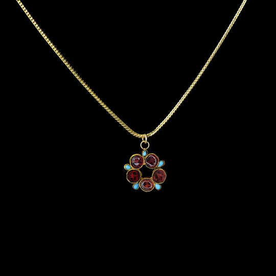 An Ottoman turquoise and garnet inlaid drop pendant, Ottoman Empire, ca. 15th - 17th century