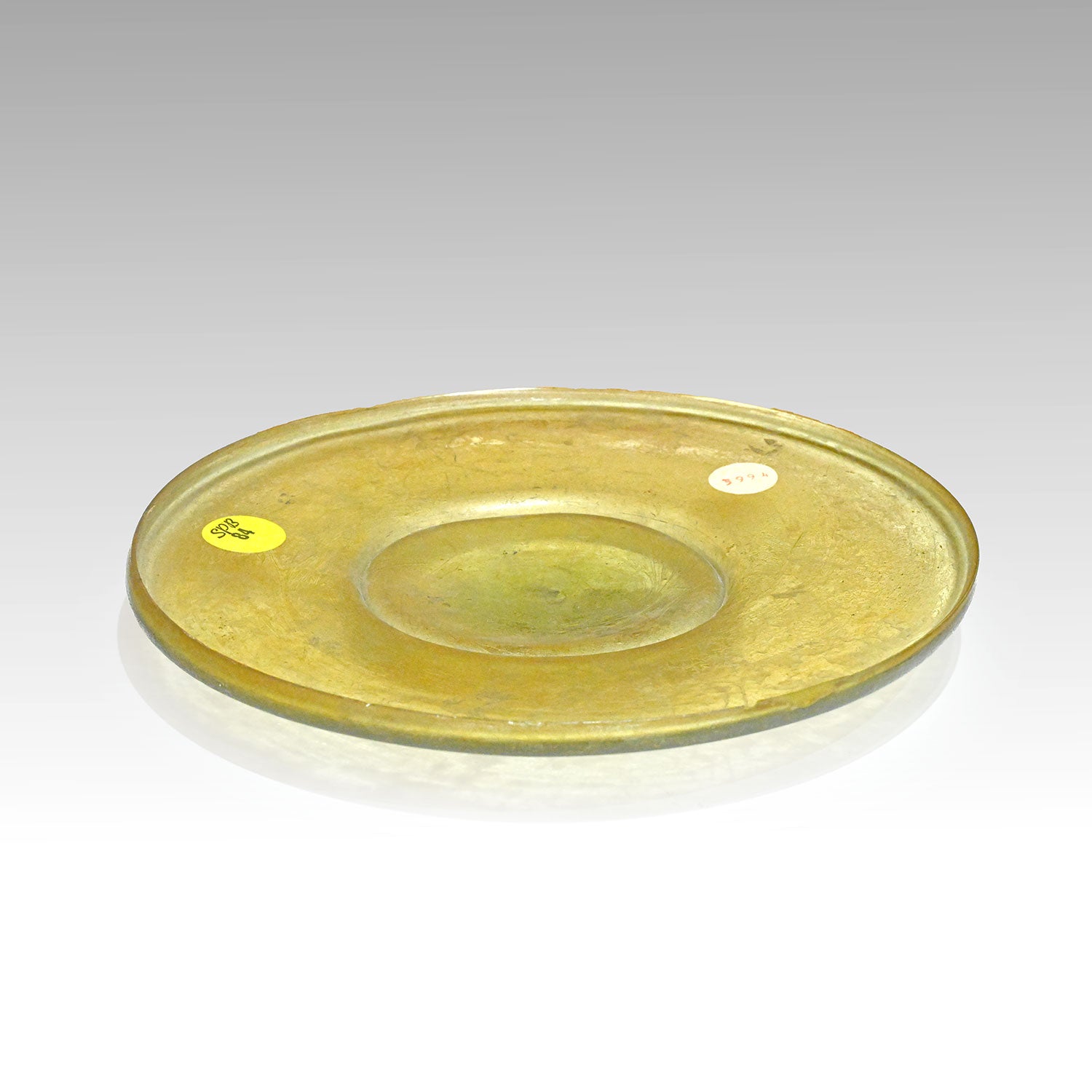 A Roman Yellow Glass Plate, Roman Imperial Period,  ca. 1st century CE