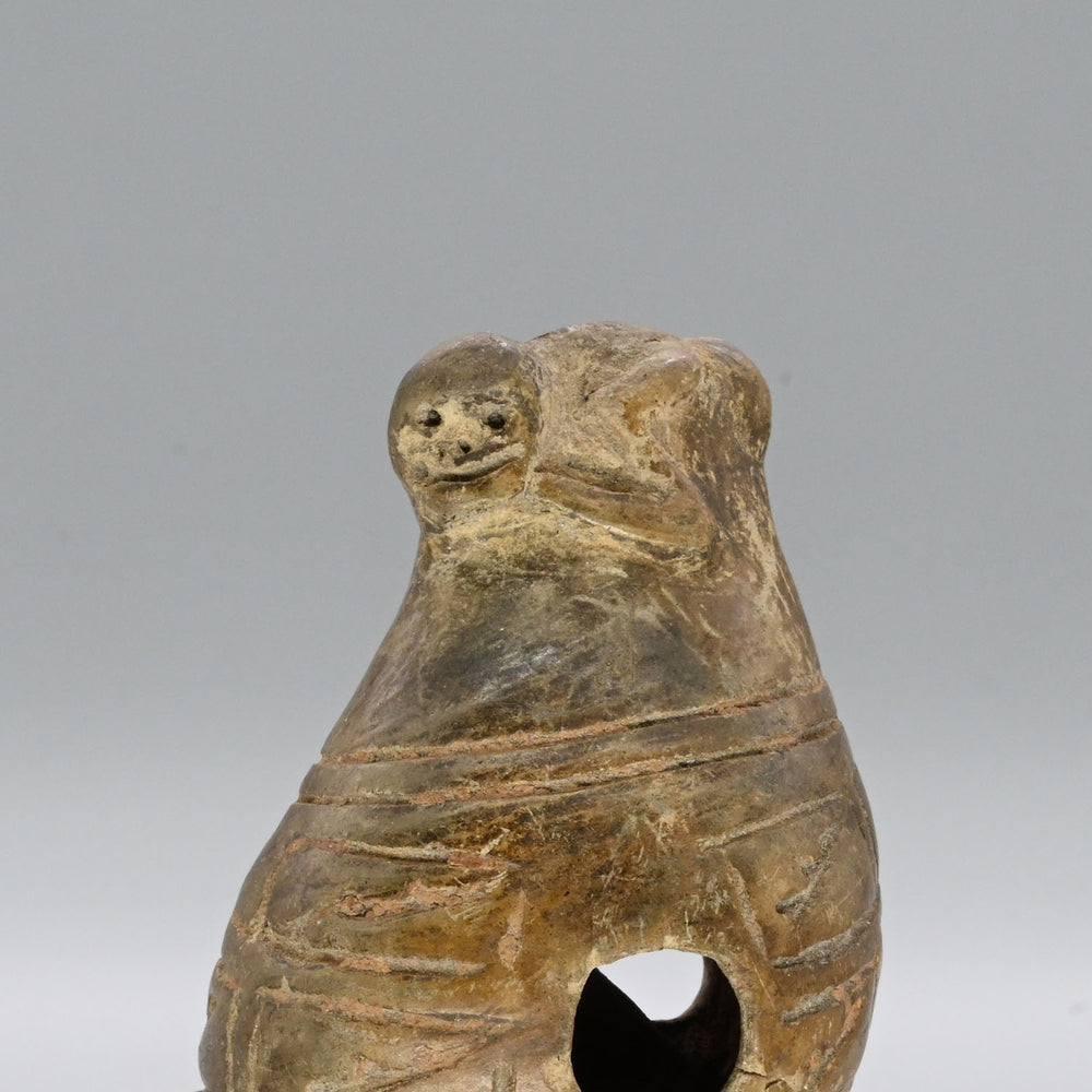 A Narino Pottery Shell Form Ocarina, Classical Period, ca. 500 - 1000 CE