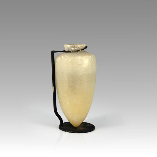 An Egyptian pointed-base alabastron, New Kingdom, ca. 1570 - 1070