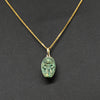An Egyptian Green Glazed Hathor Scaraboid, New Kingdom, 18th - 19th Dynasty, ca 1550-1290 BCE