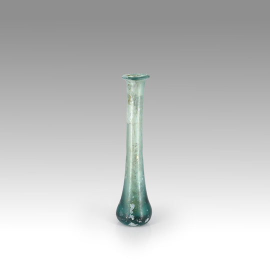A Roman Aqua Blue Glass Tear Bottle, Roman Imperial Period, ca. 1st - 2nd century CE