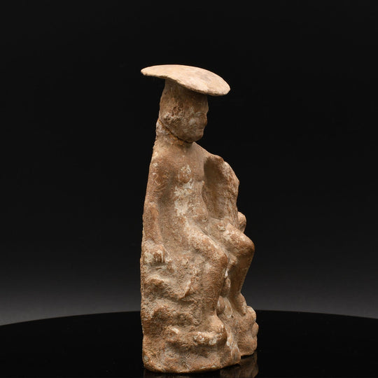 An Attic terracotta Seated Boy with Dog<br><em>Boeotia, ca. 330 - 300 BCE</em>
