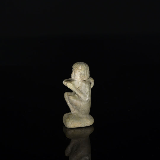 An Egyptian Faience Amulet of a Supplicant, Late Period, ca. 664 - 332 BCE