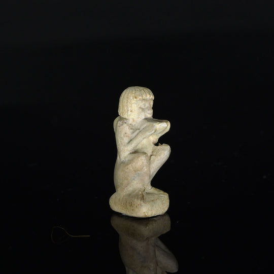 An Egyptian Faience Amulet of a Supplicant, Late Period, ca. 664 - 332 BCE