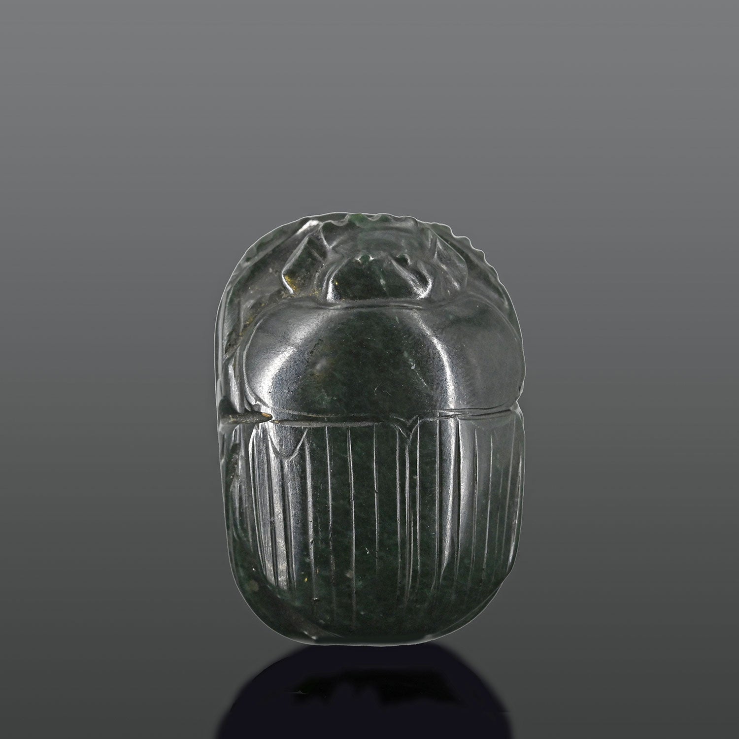 An exhibited Egyptian Green Serpentine Heart Scarab, 26th Dynasty, ca. 664 - 525 BCE