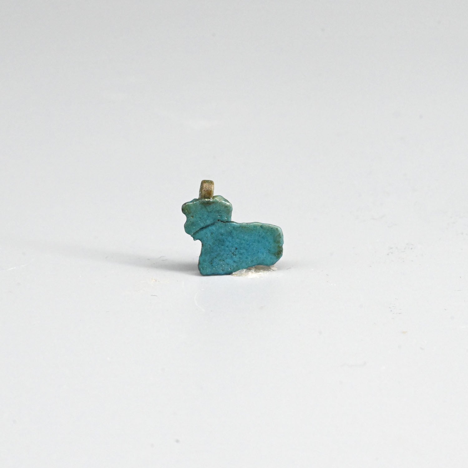 An Egyptian Blue Faience Cow Amulet, Late Period ca. 664 - 332 BCE