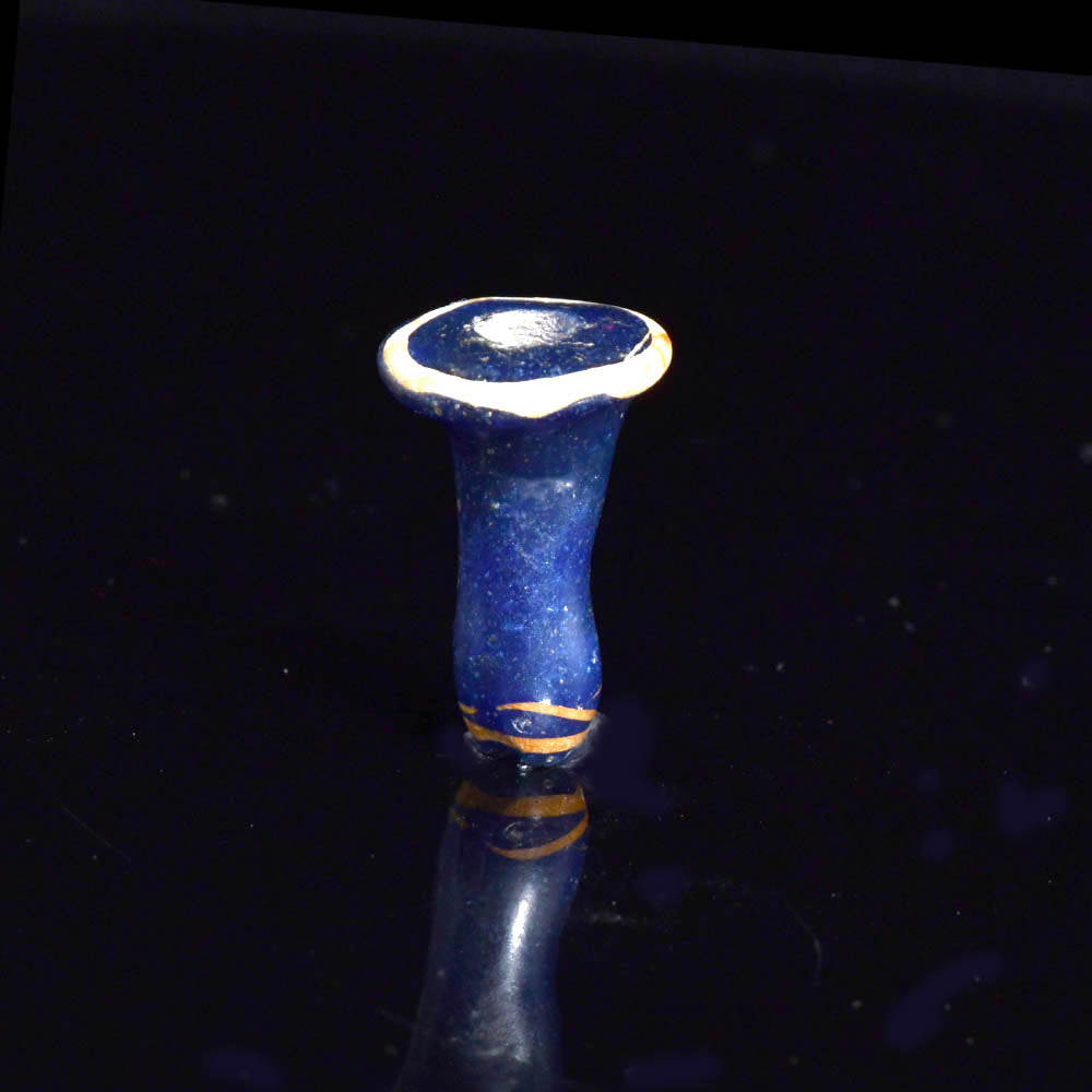 An Egyptian Blue Glass Ear Stud, 18th - 19th Dynasty, ca. 1350 - 1250 BCE