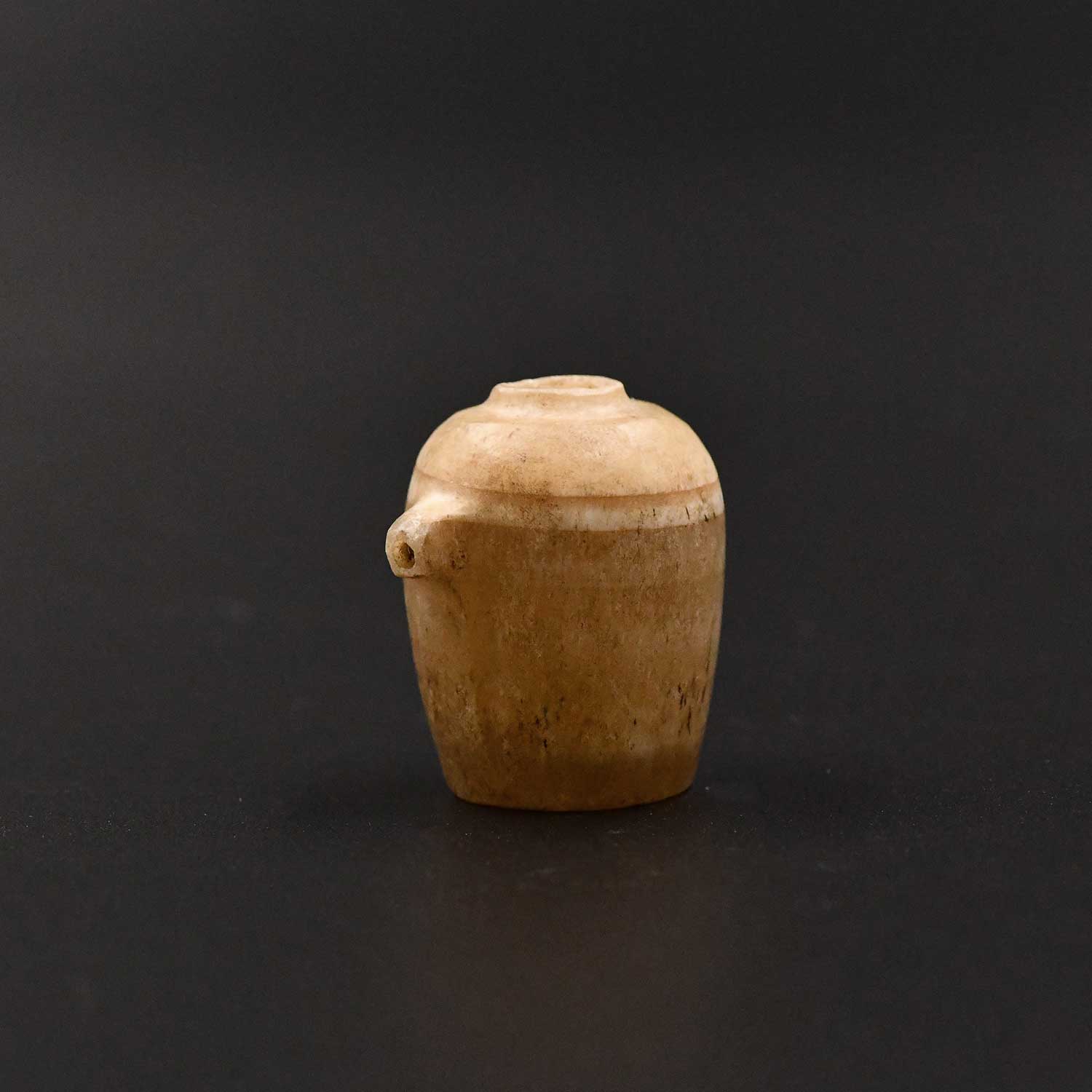 An Egyptian Alabaster Model Libation (nemset) Jar, Old Kingdom, ca. 2775 – 2650 BCE