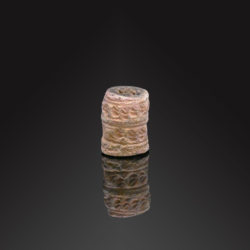 A Near Eastern Limestone Cylinder Seal, ca. 4th millennium BCE