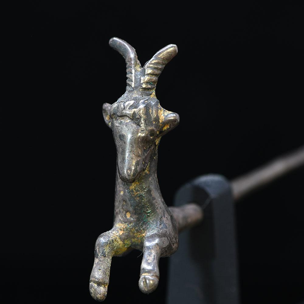 A Near Eastern silver Goat Pin, ca. 200 BCE - 200 CE