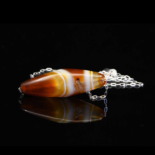 A Western Asiatic Banded Agate Bead Pendant, ca 1st millennium BCE ...