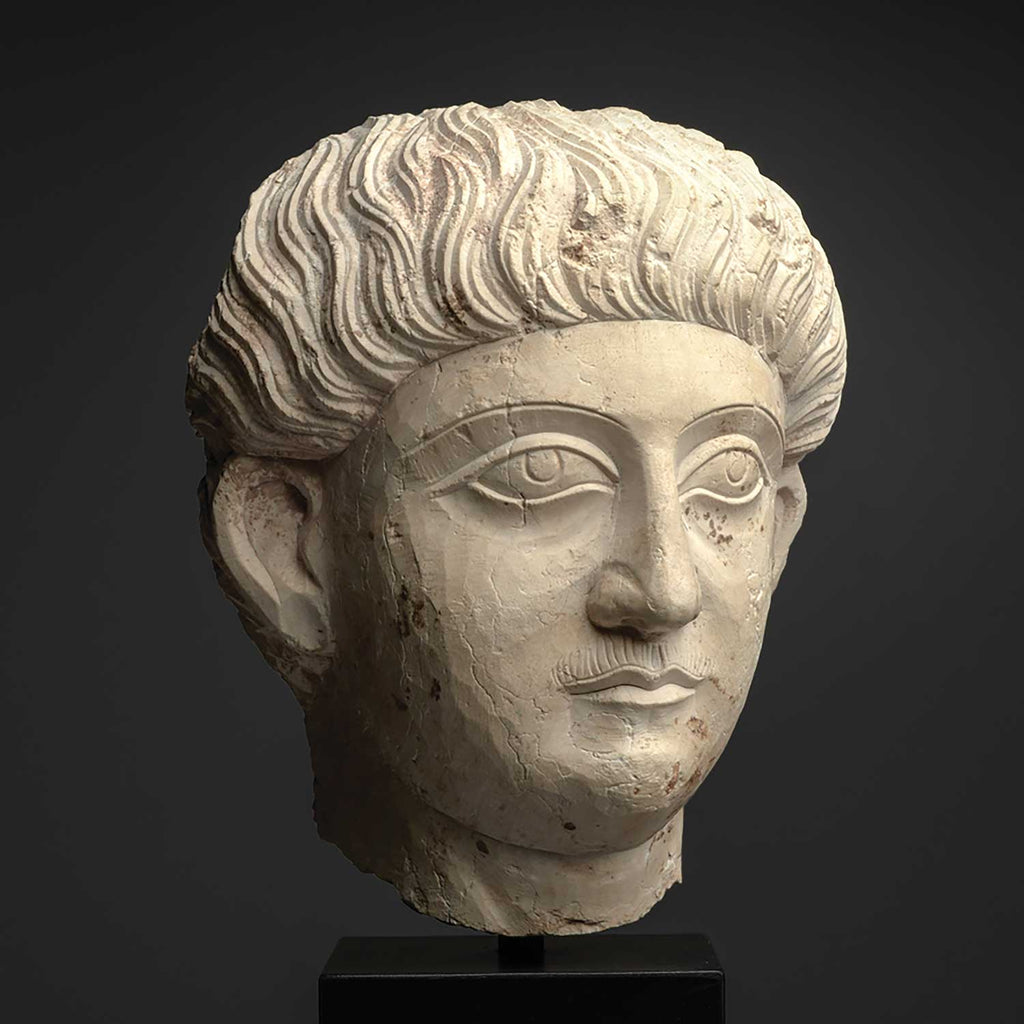 A good Palmyrene Limestone Portrait Head of a Youth ca. 2nd - 3rd century CE