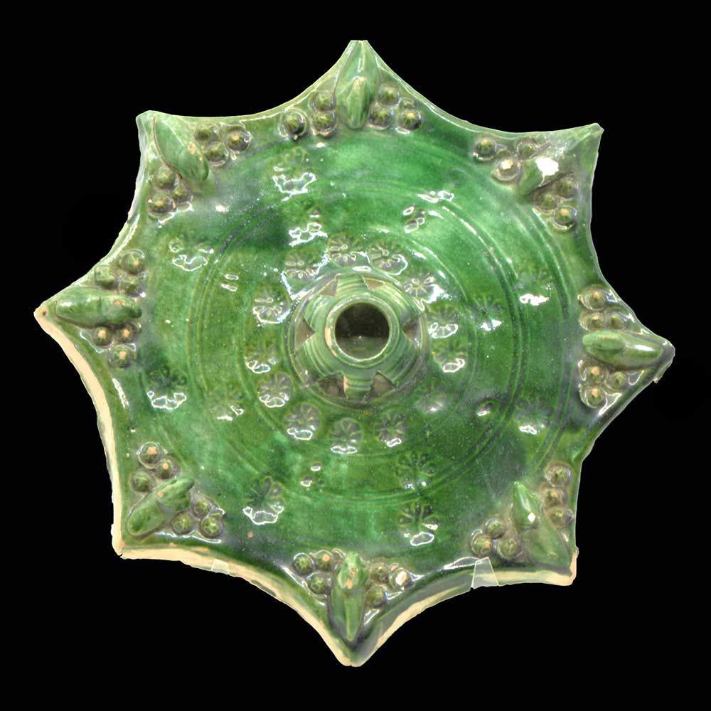 An Islamic Green Glazed Star Tile, ca. 15th - 16th century