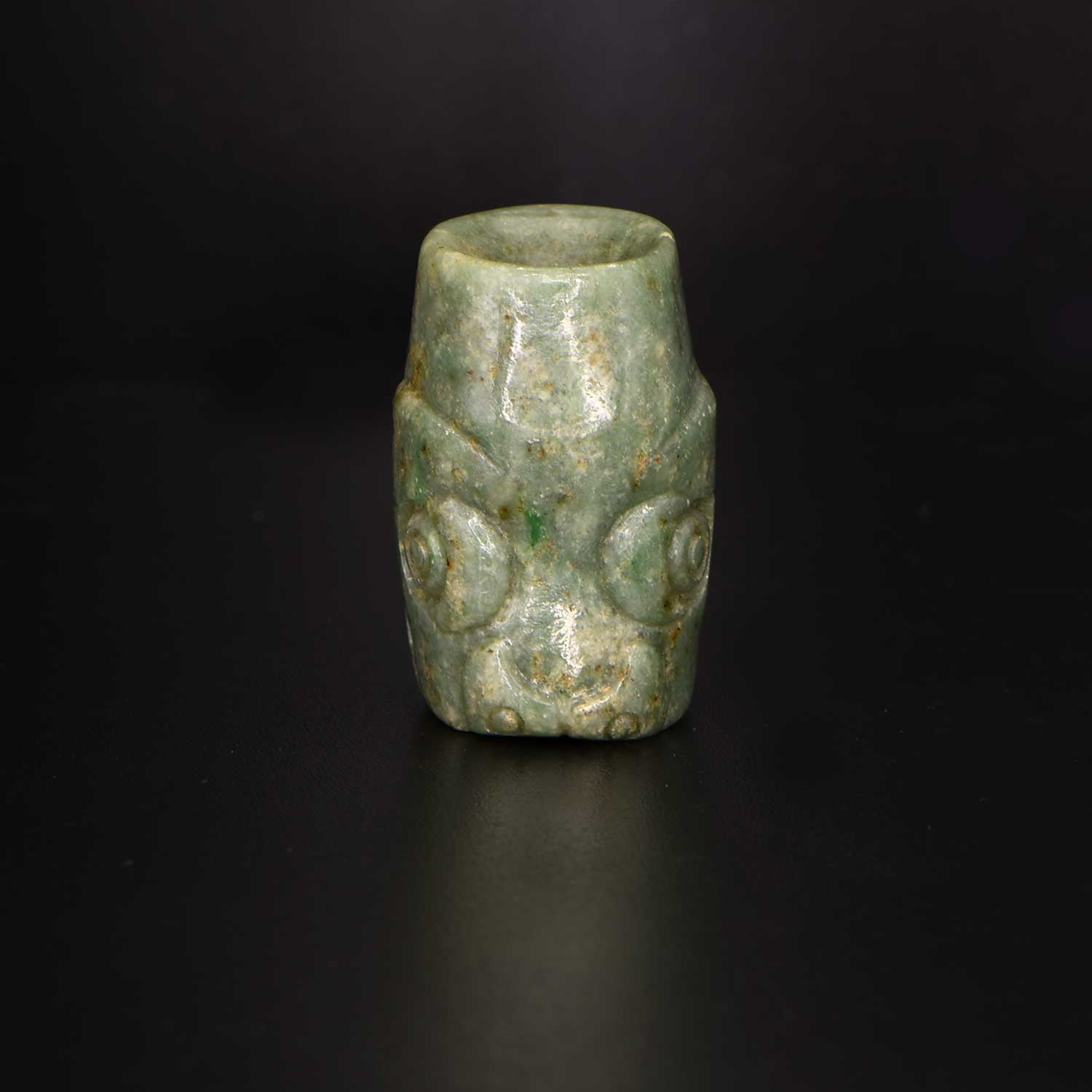 A rare Mixtec Serpent Head Jade Bead, ca. 13th - 15th century CE