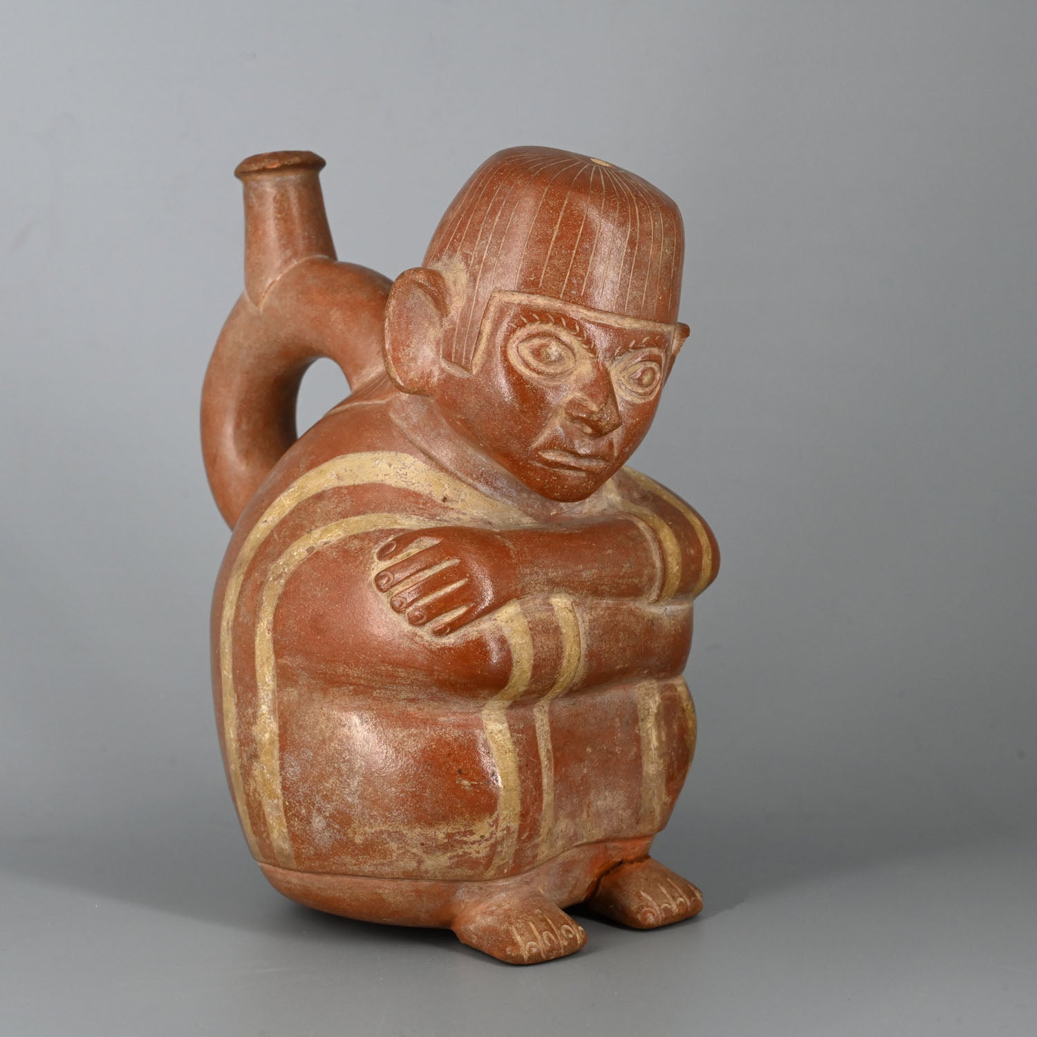 A Moche Stirrup Bottle with a Seated Man, ca. 200 - 400 CE