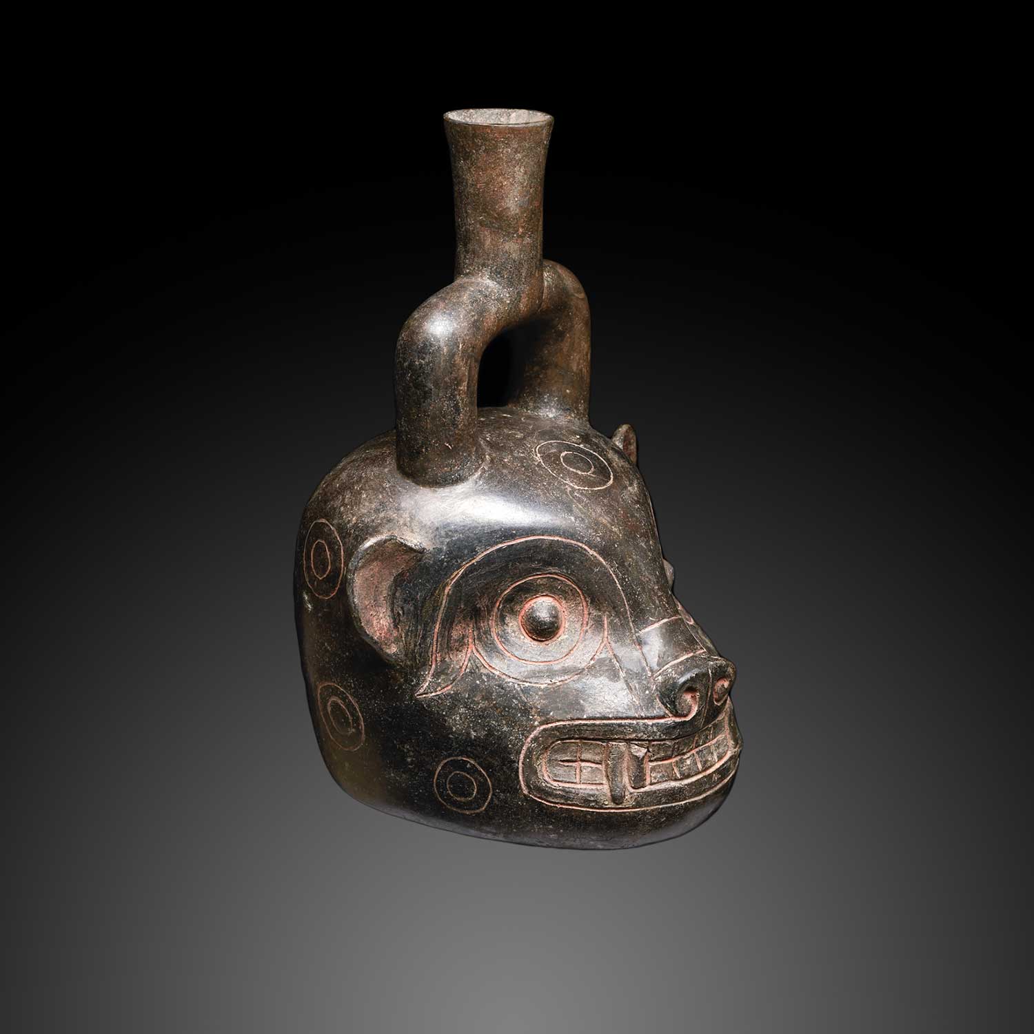A Chavin Blackware Jaguar Head Stirrup Vessel, <br><em>ca. 400 - 200 BCE</em>