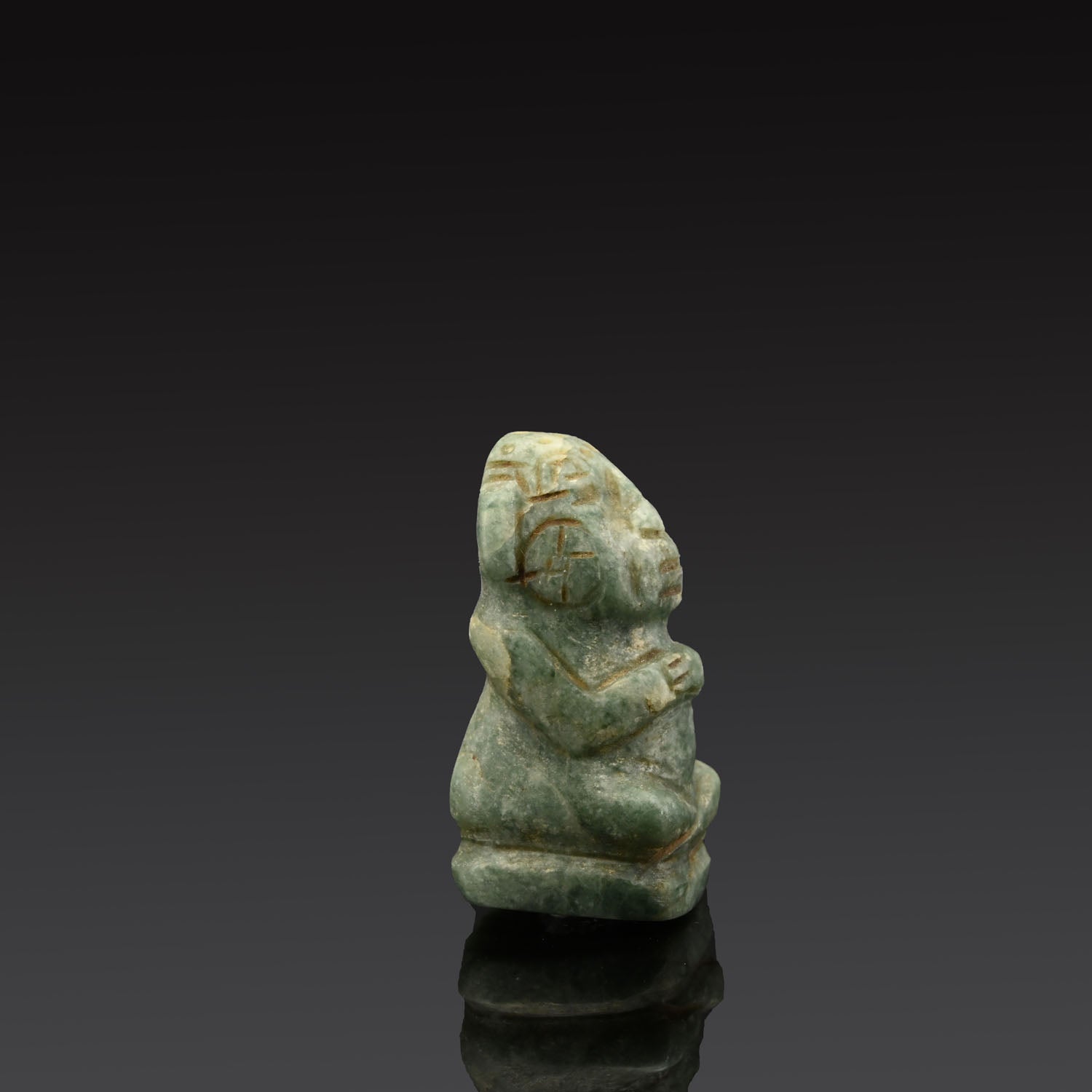 A Seated Mayan Jade Figure, Classic Period, ca. 600 - 1400 CE