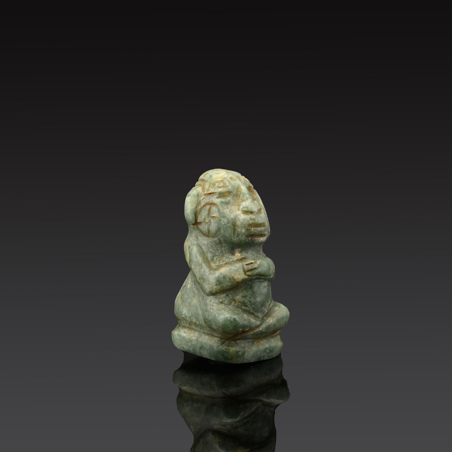 A Seated Mayan Jade Figure, Classic Period, ca. 600 - 1400 CE