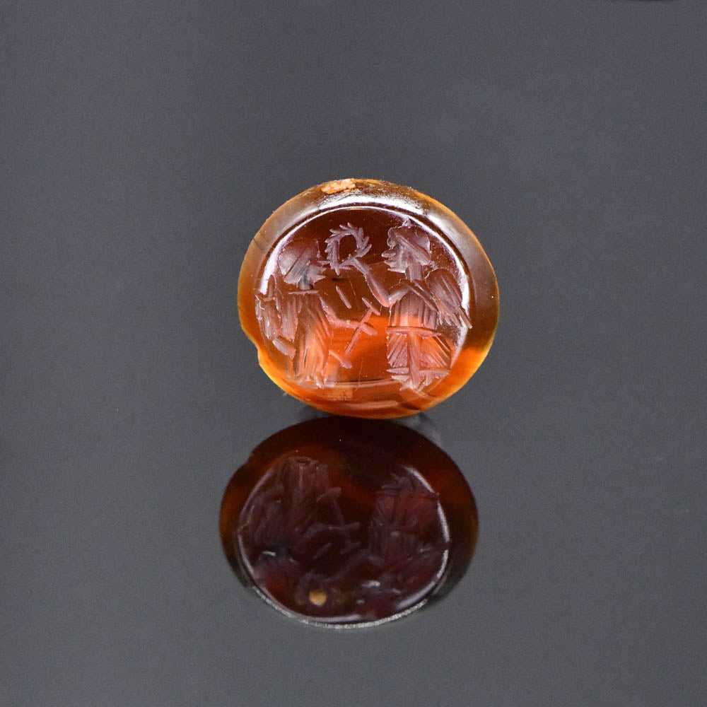 A Roman Carnelian Intaglio of Victory Crowning Fortuna, Roman Imperial Period, ca. 2nd century CE