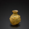 A Roman Amber Glass Bottle, ca. 2nd - 3rd century CE