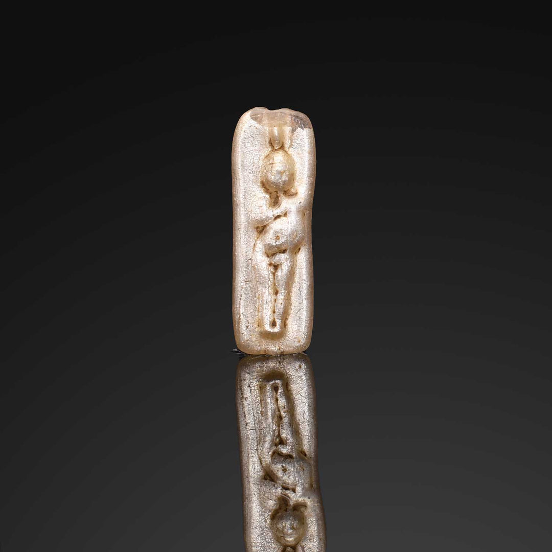 A Roman Electrum-Glass Bead depicting Harpokrates, Early Roman Imperial Period, ca. 50 BCE – 50 CE