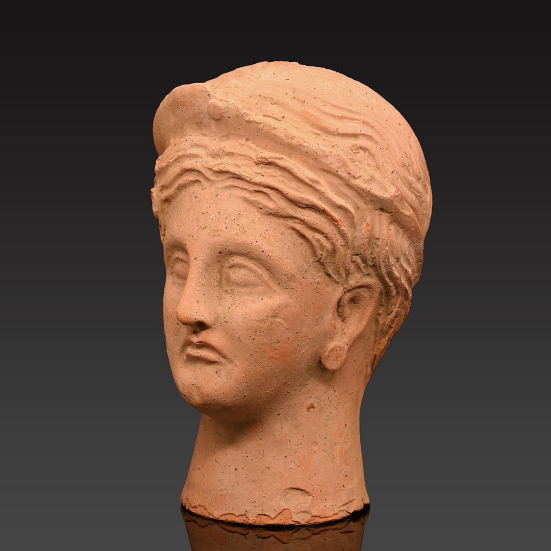 An Etruscan Terracotta Votive Head of A Goddess, <br><em>ca. 4th - 3rd century BCE</em>