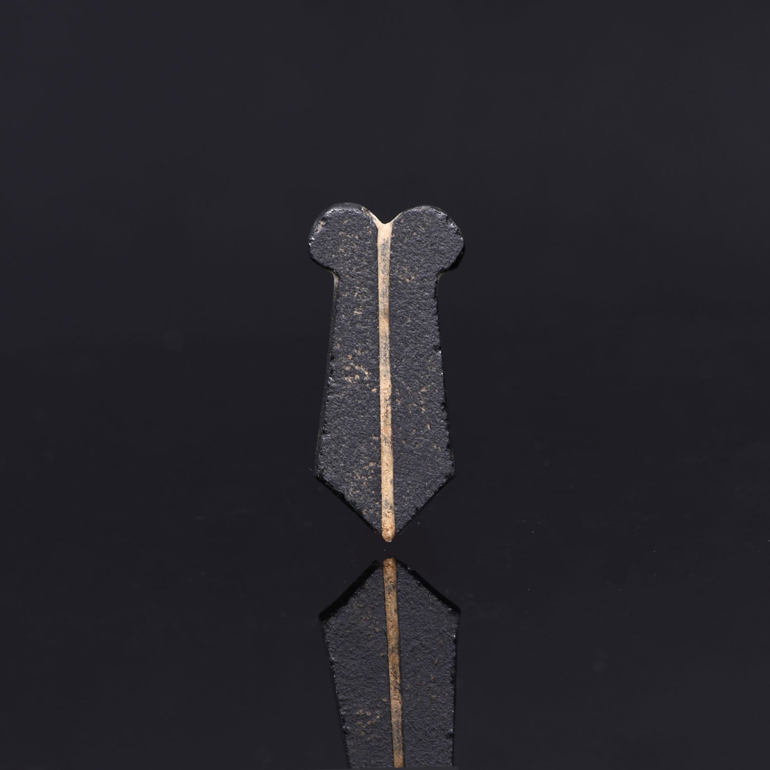 An Egyptian Obsidian Double Maat Feather Amulet, Late Period, 26th Dynasty, ca. 664 - 525 BCE